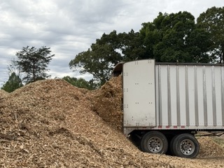 trailer dumping wood chips